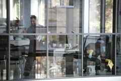 full-shot-smiley-man-cleaning-window-1-scaled