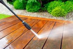 cleaning terrace with a power washer - high water pressure cleaner on wooden terrace surface - shallow depth of field +48501034200;  wkozielczyk@gmail.com